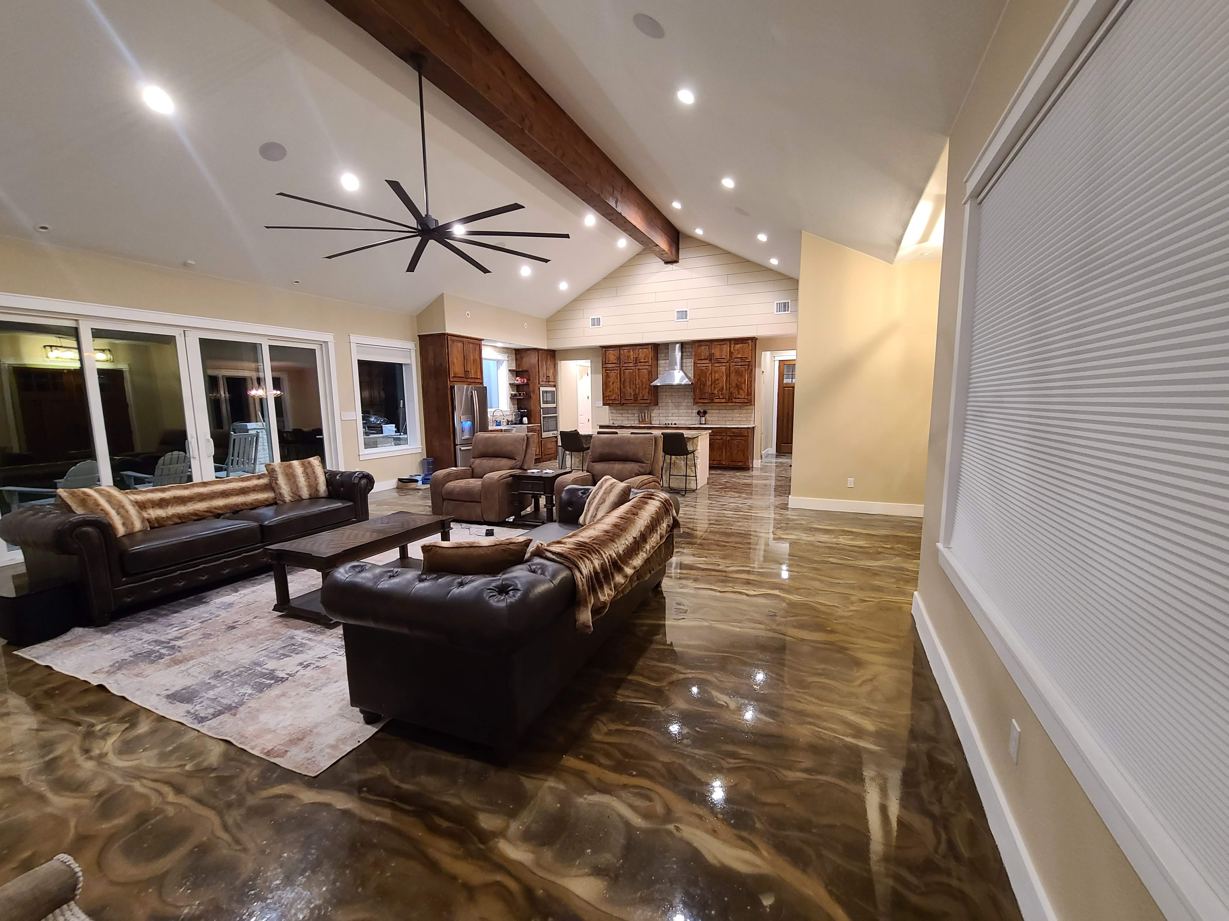 Custom vaulted living room with epoxy floor