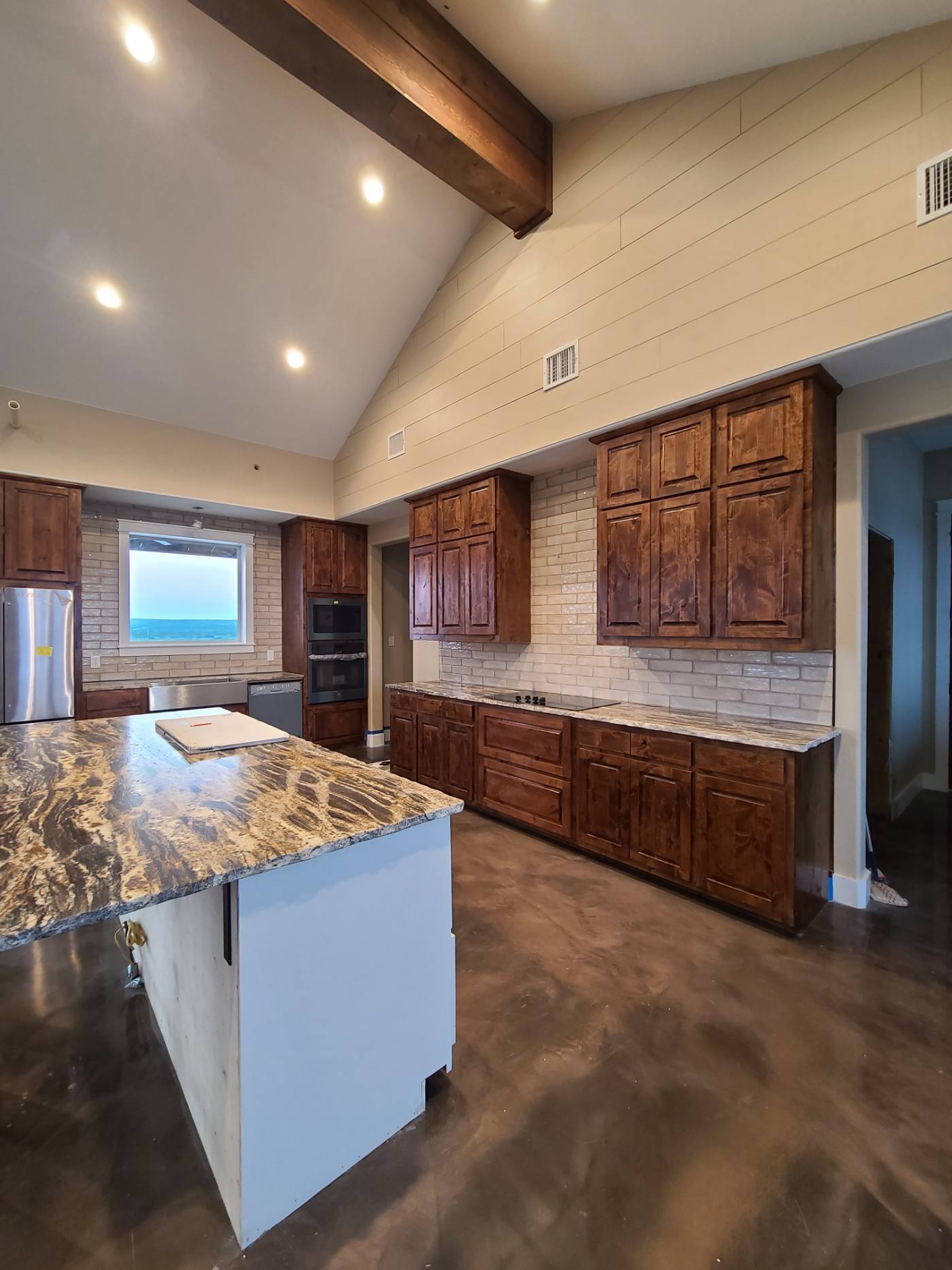 Custom knotty alder vaulted kitchen cabinetry — IAH Innovations